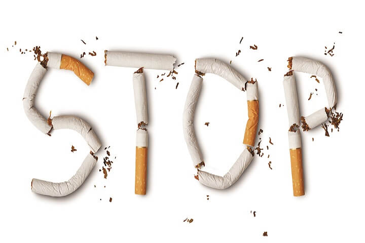 STOP word formed from broken pieces of cigarettes.
