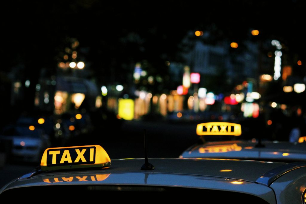 taxi signs one behind each other