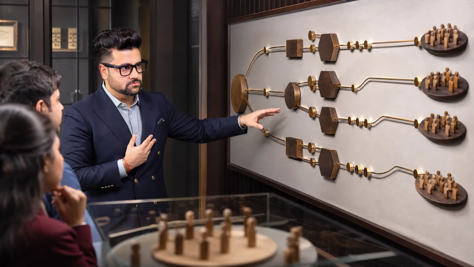 Sahil Khanna reviewing an evidence wall in a behavioral research lab for Channel Marketing